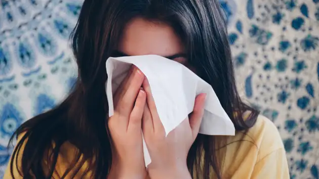Girl using tissue